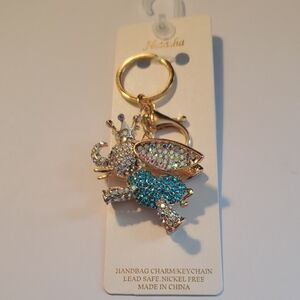 Natasha Bag Charm.flying Elephant Gold Plated.blue